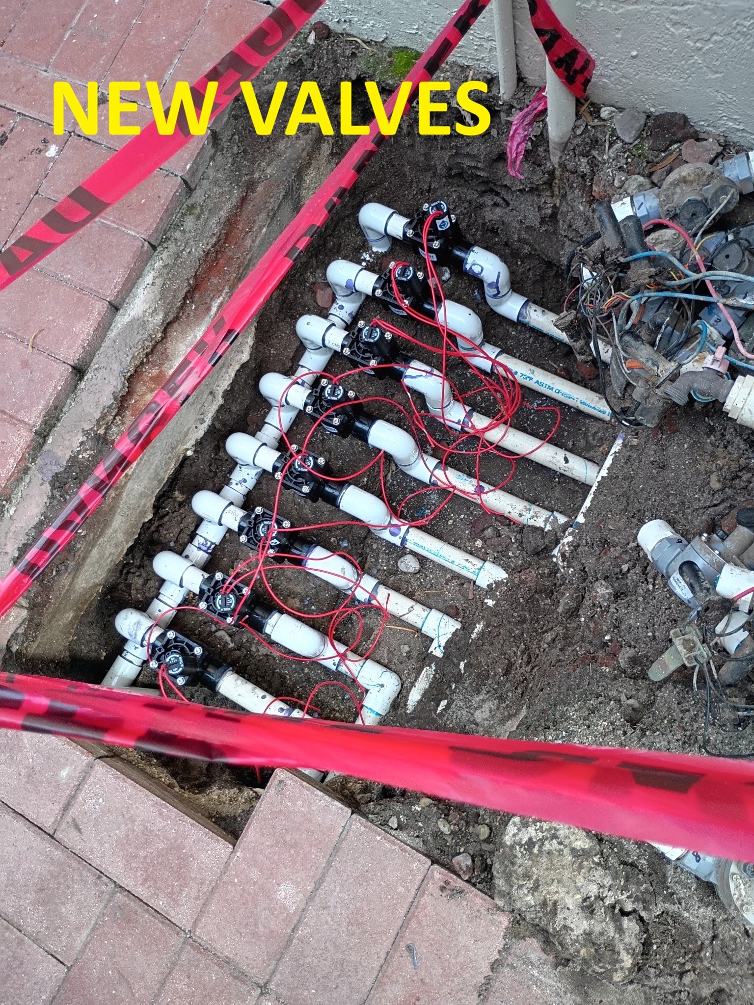 install multiple new sprinkler zone valves delray beach
